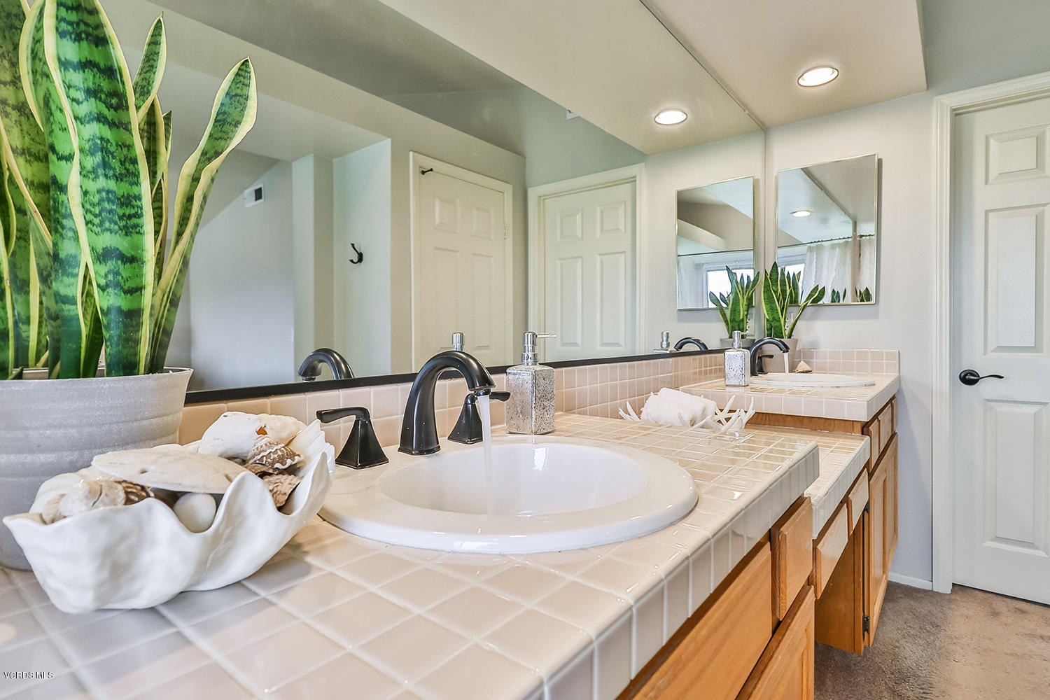 29009 Gumtree Place Saugus, CA 91390 - Photo 41 of 66 a bathroom with a double vanity sink and a mirror