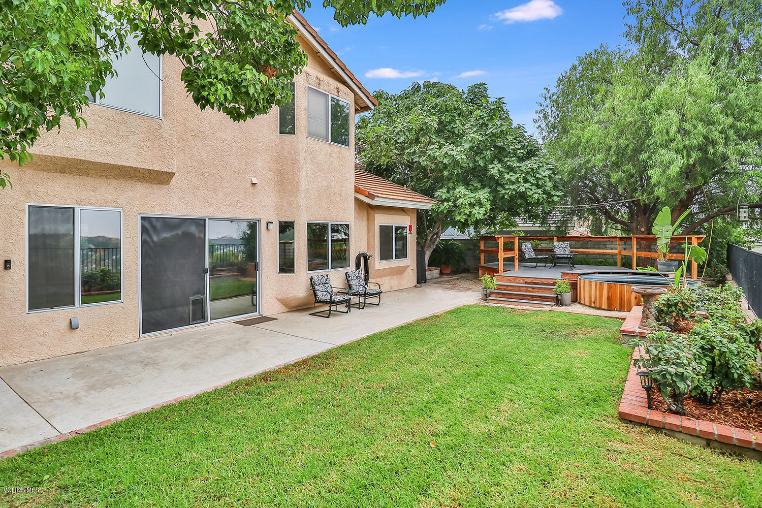 29009 Gumtree Place Saugus, CA 91390 - Photo 46 of 66 a view of a house with backyard sitting area and garden
