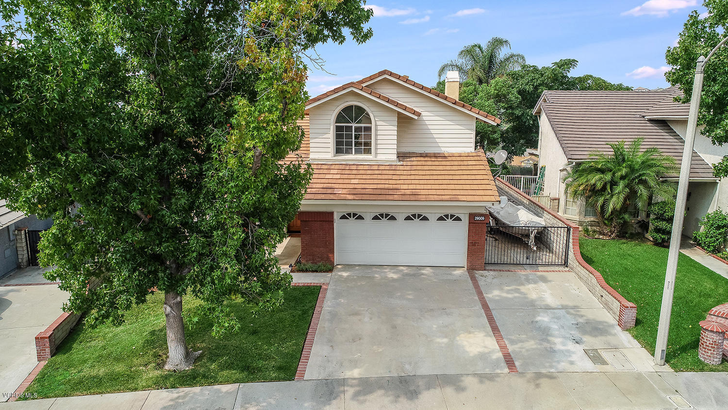 29009 Gumtree Place Saugus, CA 91390 - Photo 56 of 66 a view of house with a yard and potted plants