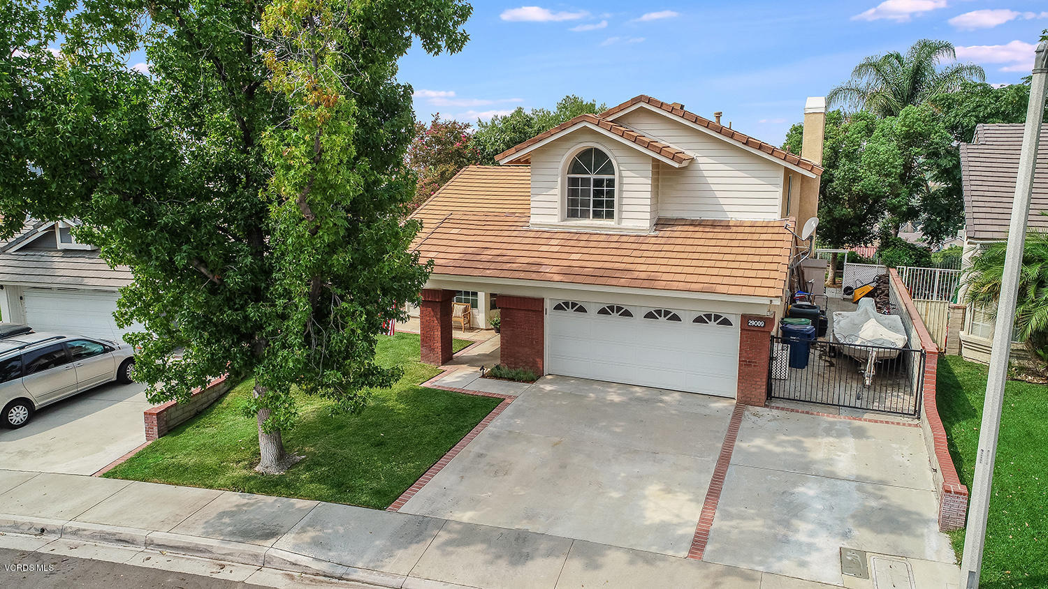 29009 Gumtree Place Saugus, CA 91390 - Photo 57 of 66 a front view of a house with a garden