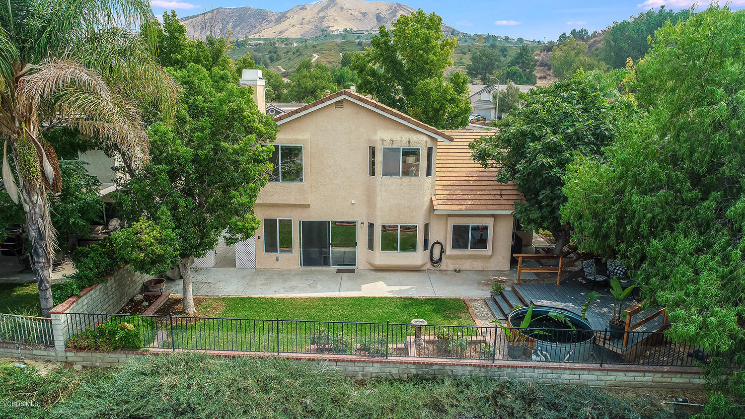 29009 Gumtree Place Saugus, CA 91390 - Photo 60 of 66 a view of a house with a yard and potted plants