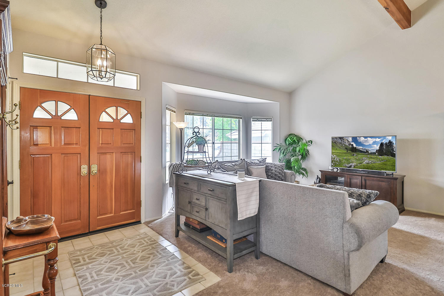 29009 Gumtree Place Saugus, CA 91390 - Photo 7 of 66 a living room with furniture a chandelier and a window