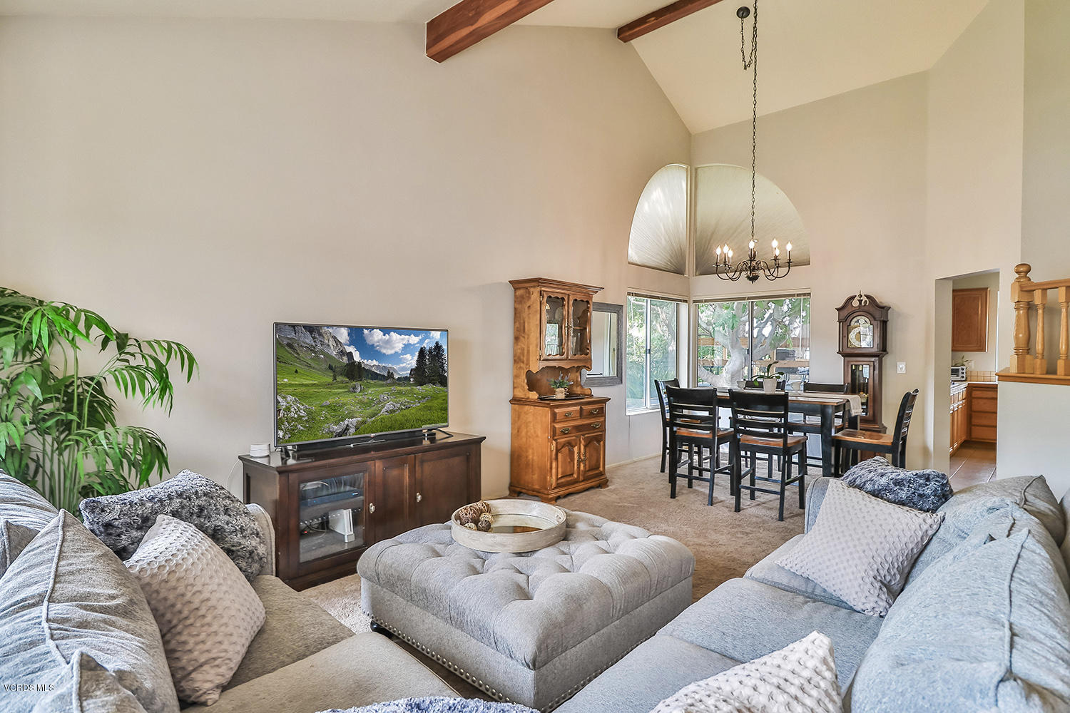 29009 Gumtree Place Saugus, CA 91390 - Photo 9 of 66 a living room with furniture a chandelier and a flat screen tv