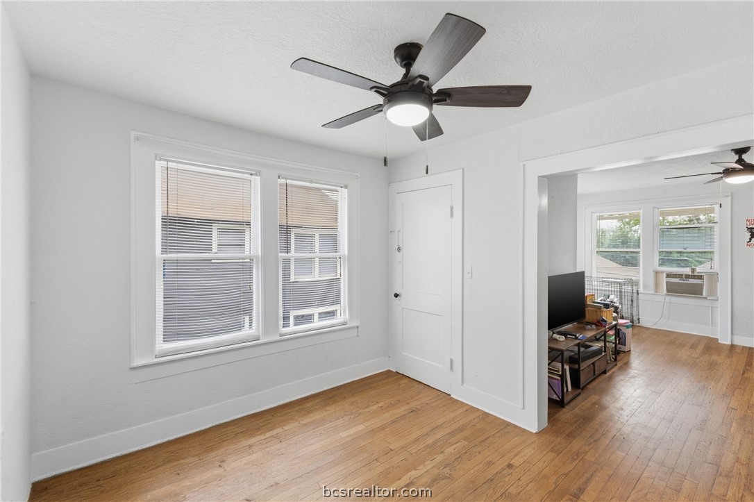 408 Hill Street Bryan, TX 77803 - Photo 12 of 50 a view of a livingroom with hardwood floor and a ceiling fan