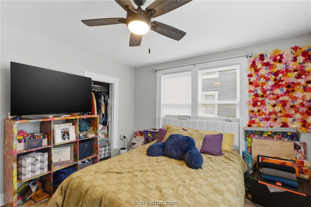 408 Hill Street Bryan, TX 77803 - Photo 28 of 50 a bed room with a bed and a flat screen tv