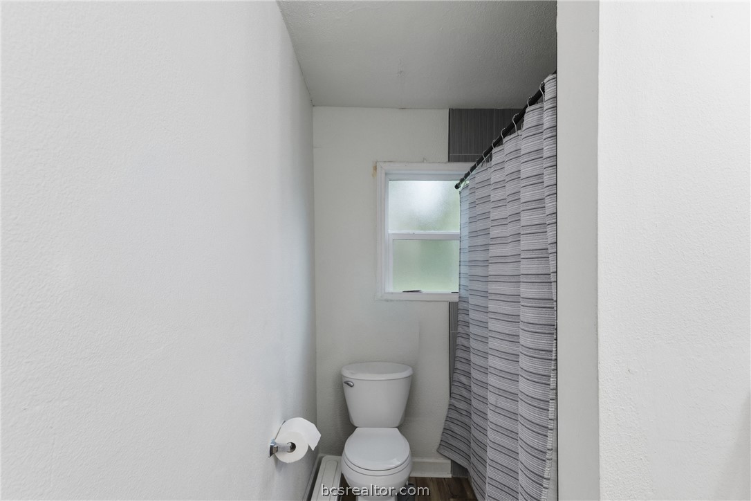 408 Hill Street Bryan, TX 77803 - Photo 35 of 50 a bathroom with a toilet and a shower