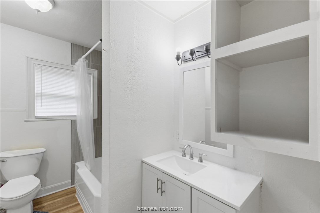 408 Hill Street Bryan, TX 77803 - Photo 10 of 50 a bathroom with a sink toilet and vanity