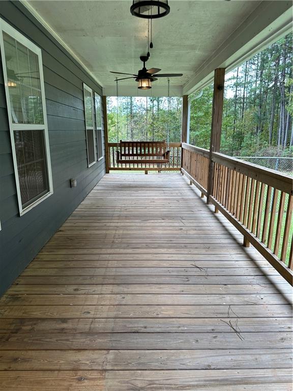 2683 Greer Road Hillsboro, GA 31038 - Photo 9 of 18 a view of a porch with wooden floor and outdoor space
