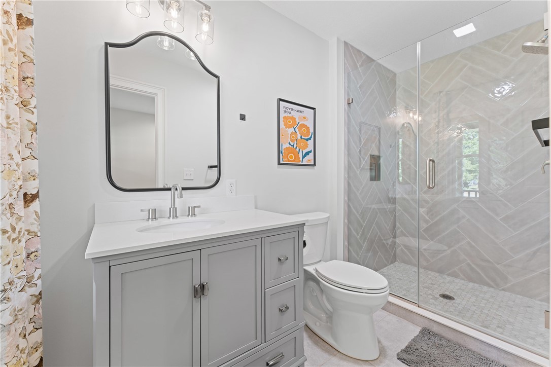 622 Jackson Road Anderson, SC 29626 - Photo 10 of 50 A well-appointed bath features a sleek vanity and a spacious glass-enclosed shower.