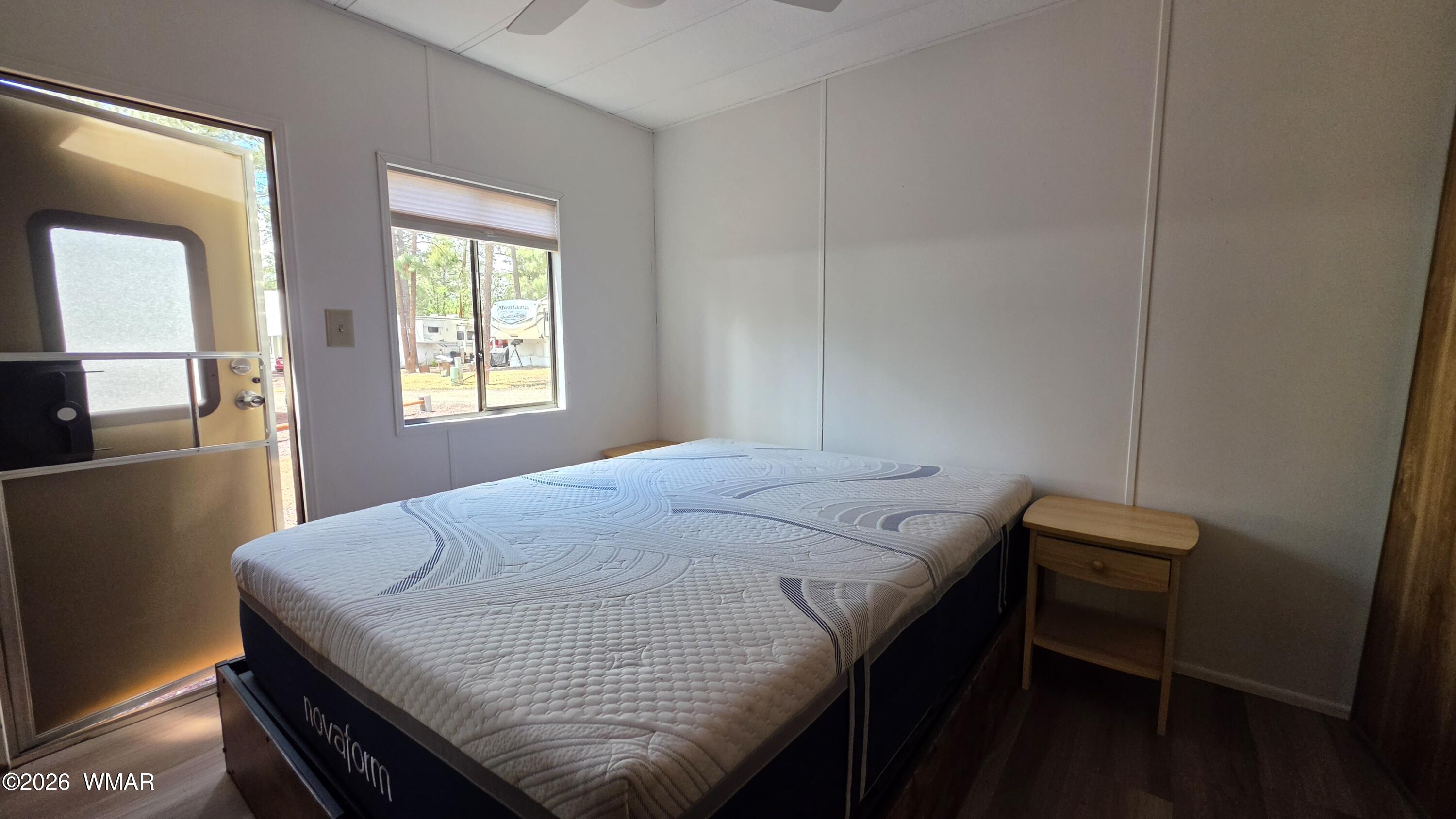 2468 Running Bear Road, Unit 44 Lakeside, AZ 85929 - Photo 11 of 11 a bedroom with a bed and window