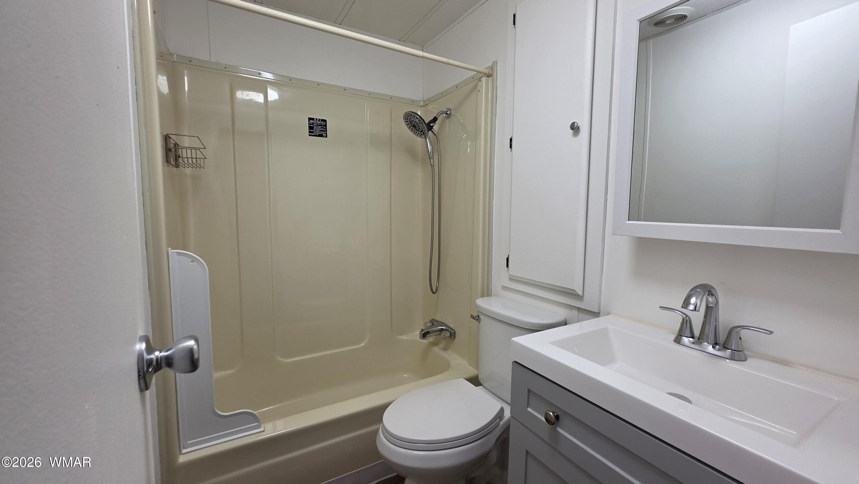 2468 Running Bear Road, Unit 44 Lakeside, AZ 85929 - Photo 9 of 11 a bathroom with a sink a toilet and shower