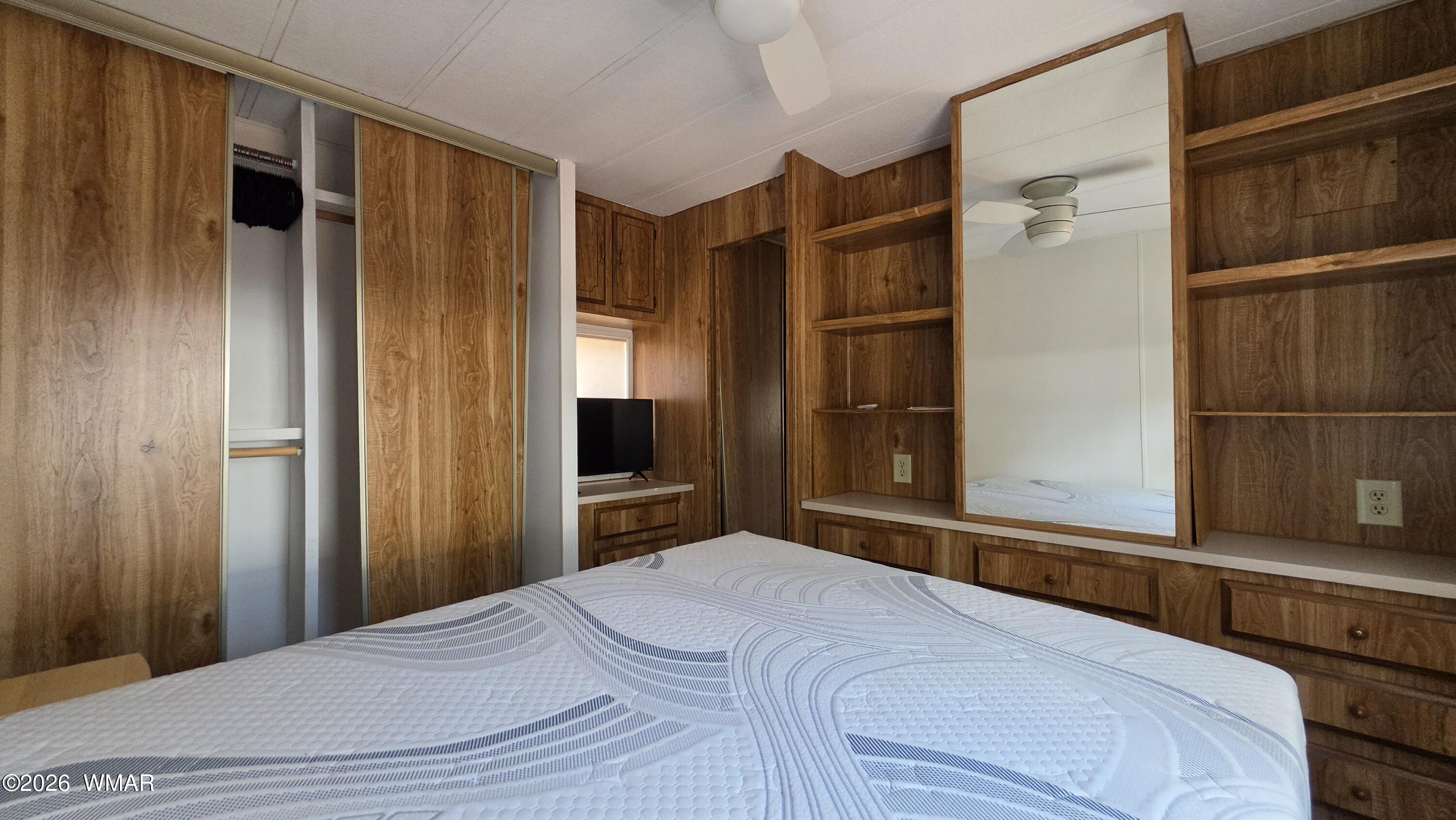 2468 Running Bear Road, Unit 44 Lakeside, AZ 85929 - Photo 10 of 11 a bedroom with a bed and a dresser