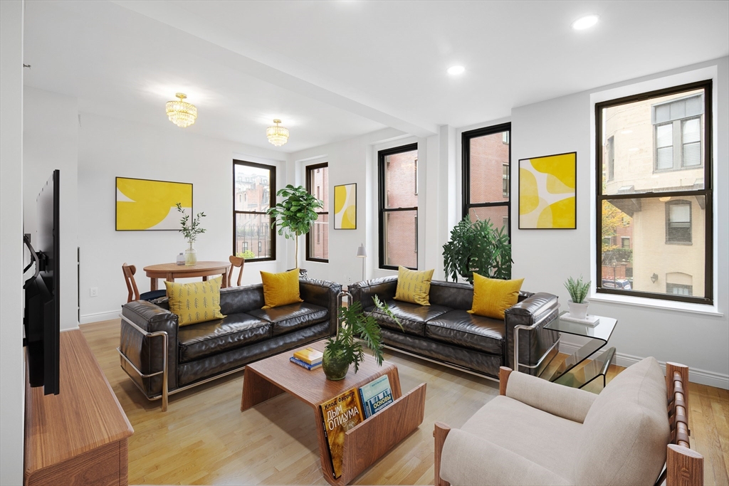4 Charlesgate East, Unit 201 Boston, MA 02215 - Photo 1 of 32 a living room with furniture and a potted plant