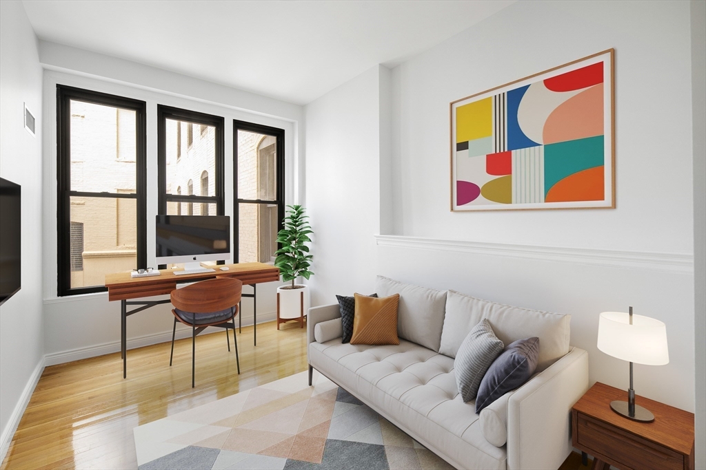 4 Charlesgate East, Unit 201 Boston, MA 02215 - Photo 16 of 30 a living room with furniture and a window