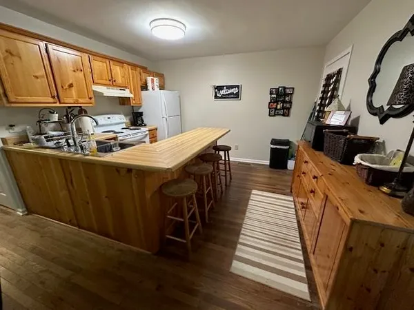 a bedroom with a bed and flat screen tv