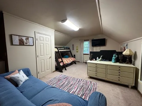 a living room with furniture and a rug