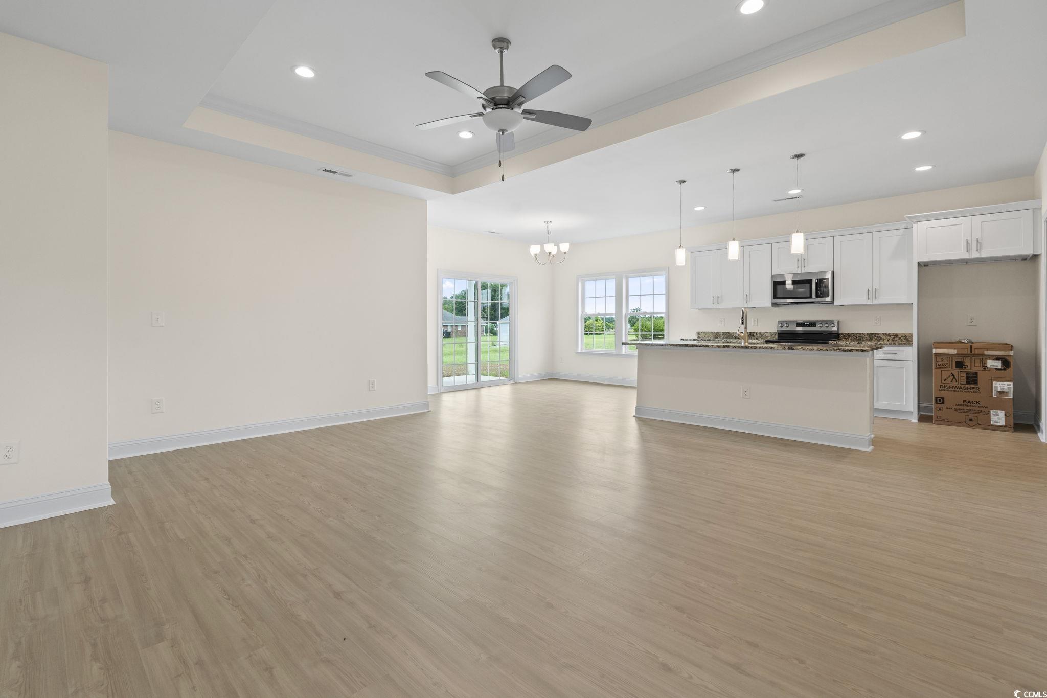 108 Infinity Lane Loris, SC 29569 - Photo 11 of 35 Unfurnished living room featuring light wood finis