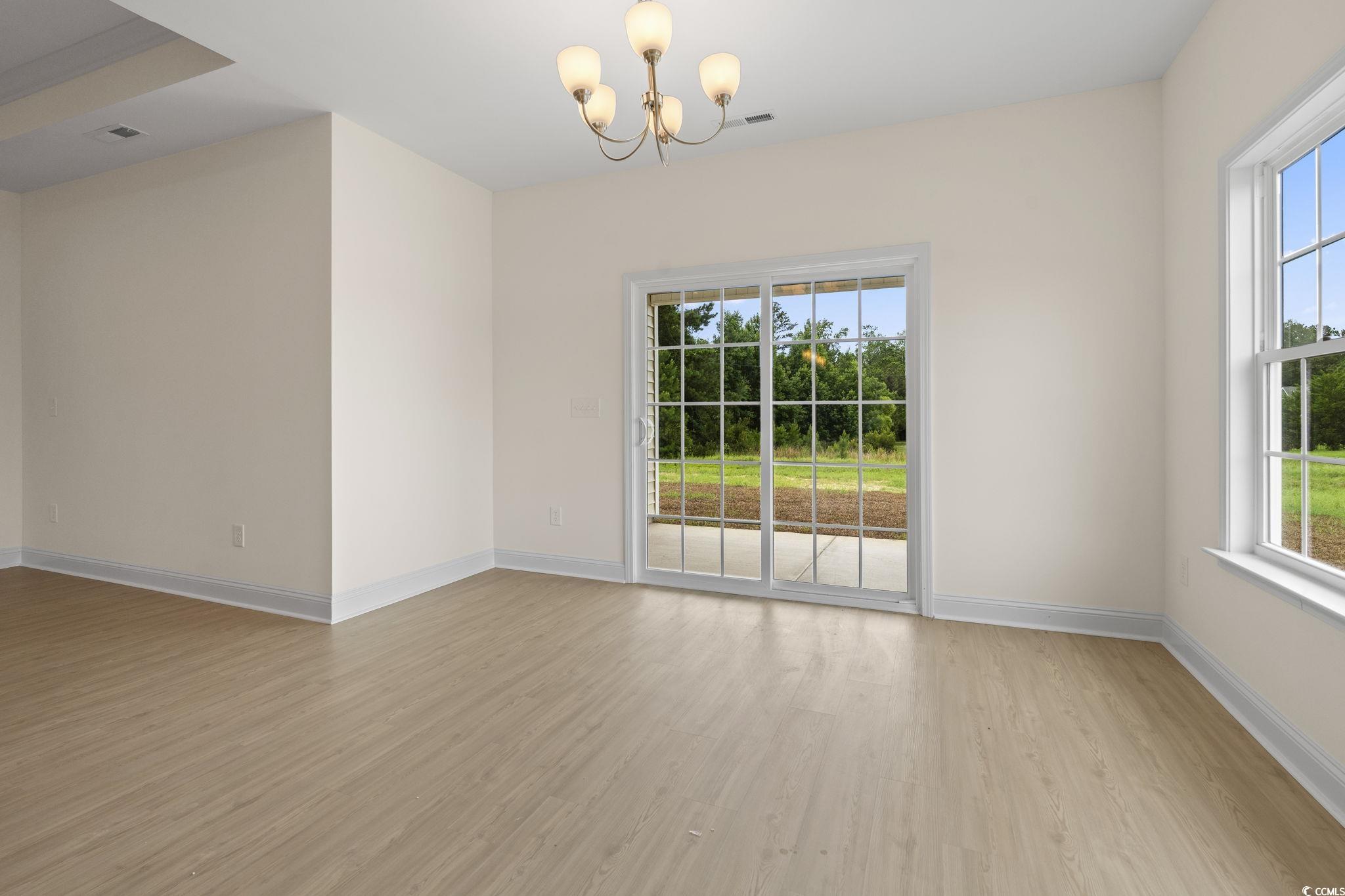 108 Infinity Lane Loris, SC 29569 - Photo 13 of 35 Dining Area with light wood finished floors, a cha