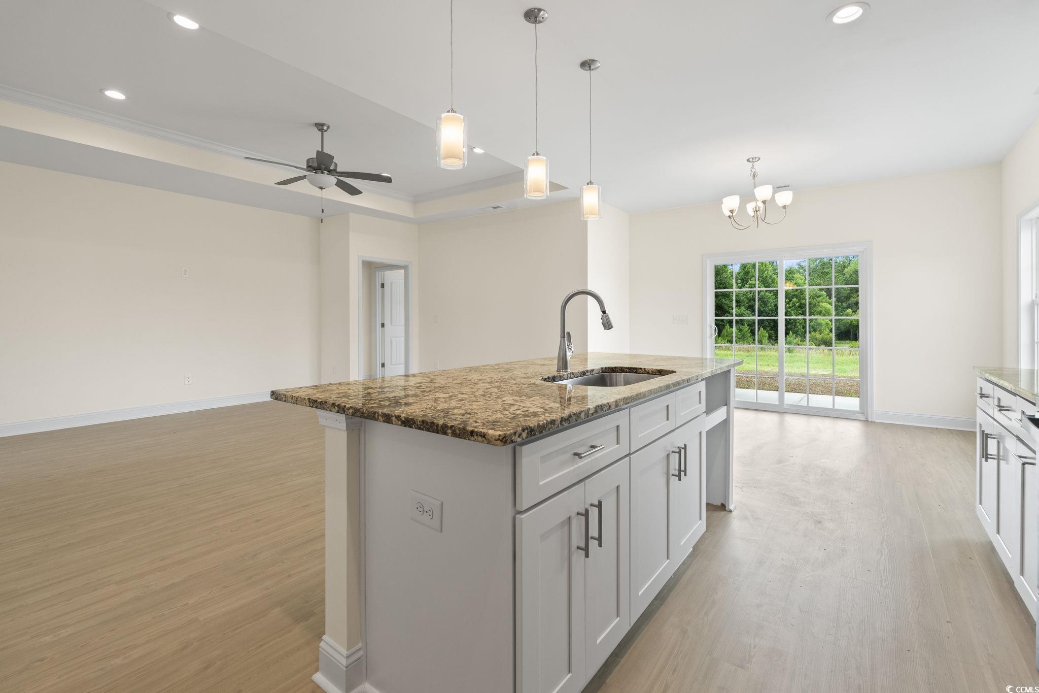 108 Infinity Lane Loris, SC 29569 - Photo 16 of 35 Kitchen featuring light wood-style flooring, dark