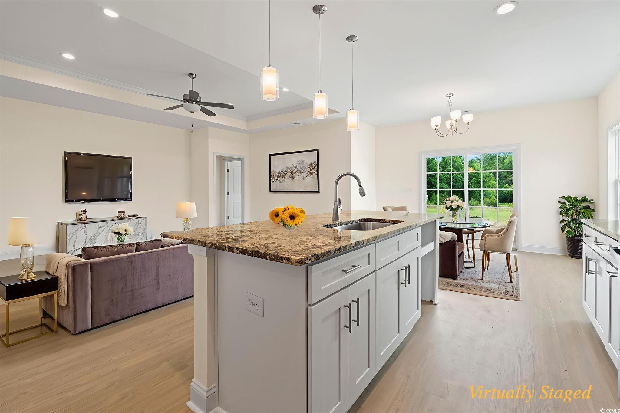 108 Infinity Lane Loris, SC 29569 - Photo 17 of 35 Kitchen featuring light wood-type flooring, stone