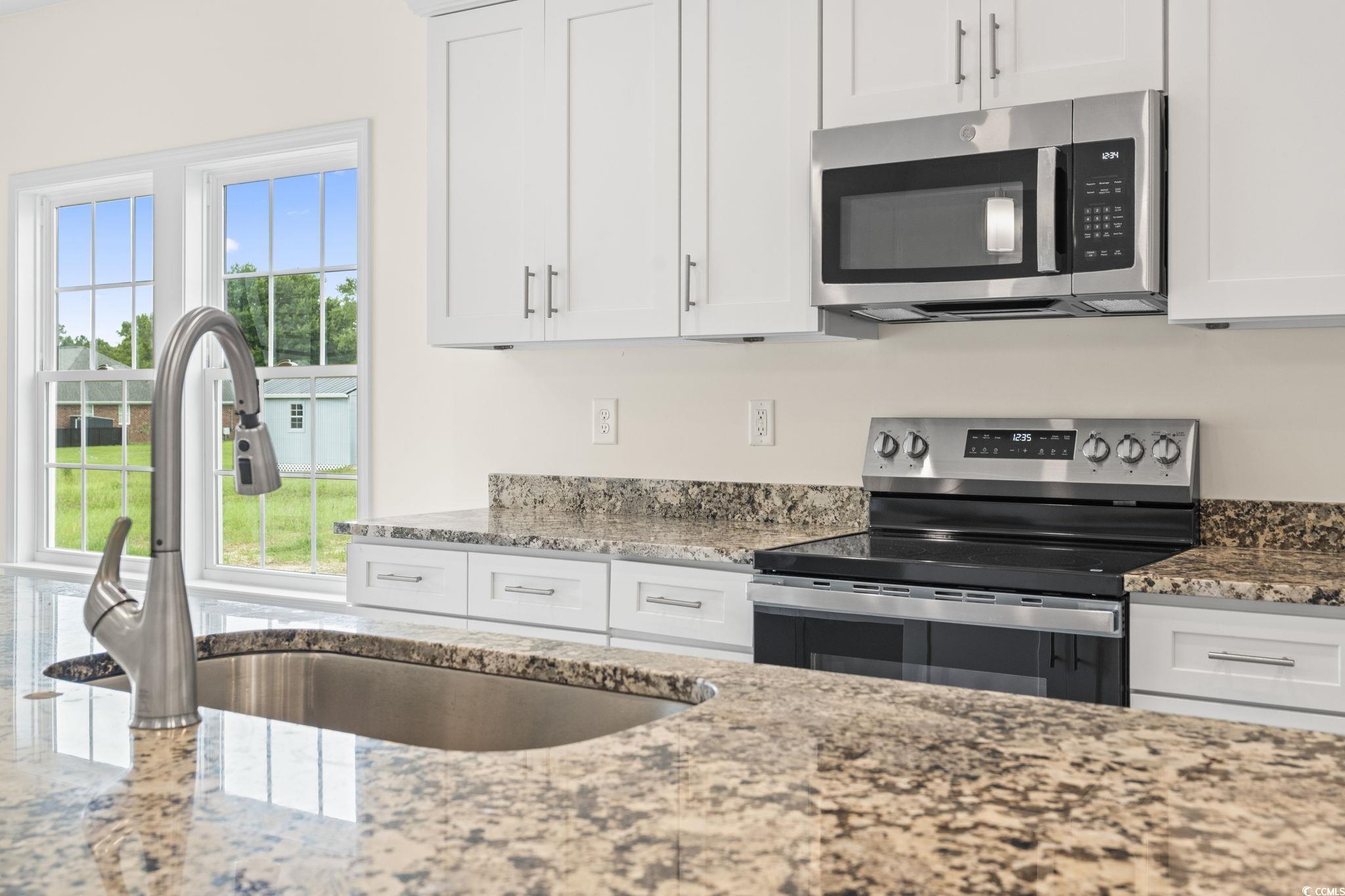 108 Infinity Lane Loris, SC 29569 - Photo 18 of 35 Kitchen with appliances with stainless steel finis