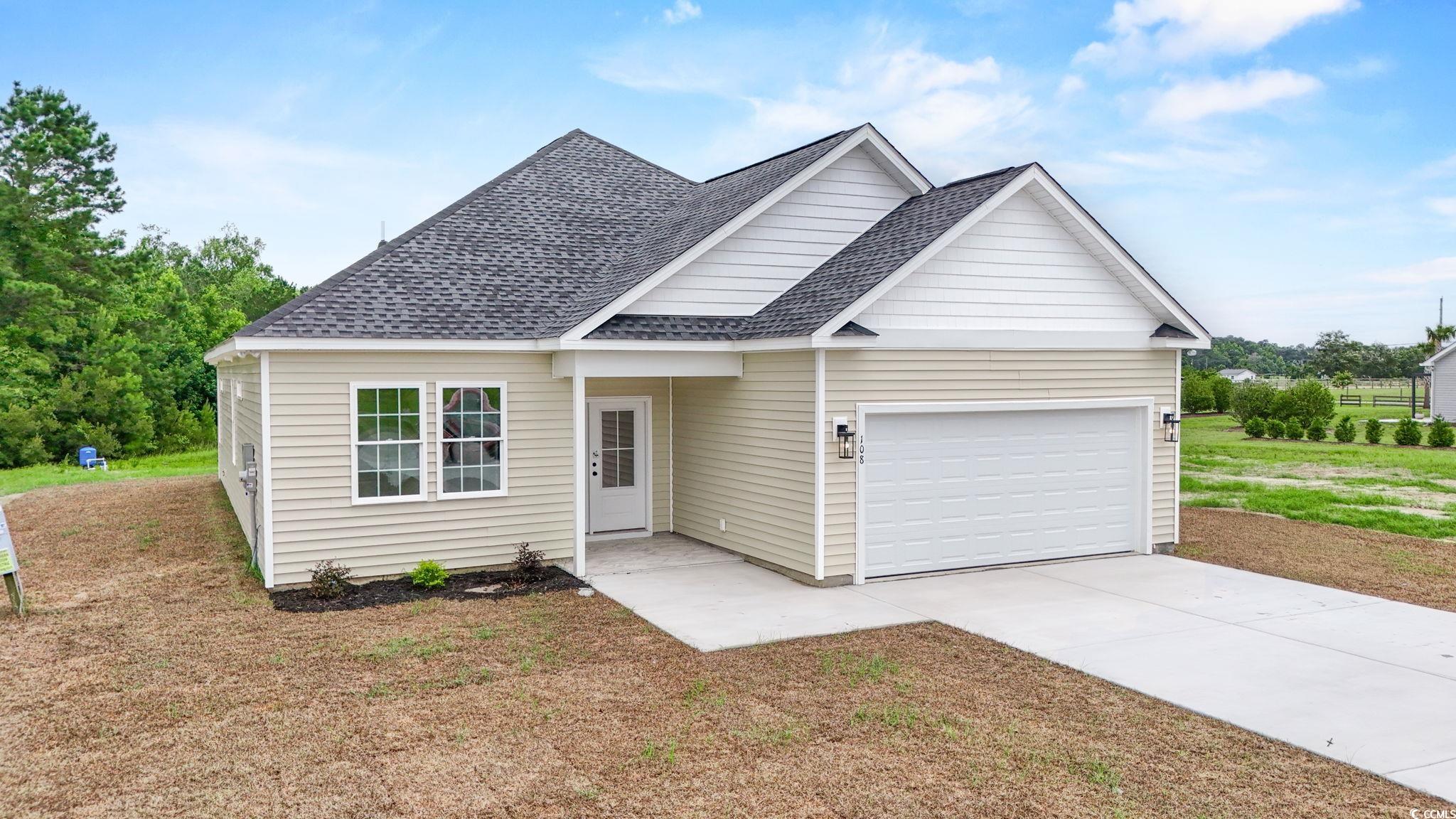 108 Infinity Lane Loris, SC 29569 - Photo 2 of 35 Traditional home featuring roof with shingles, an
