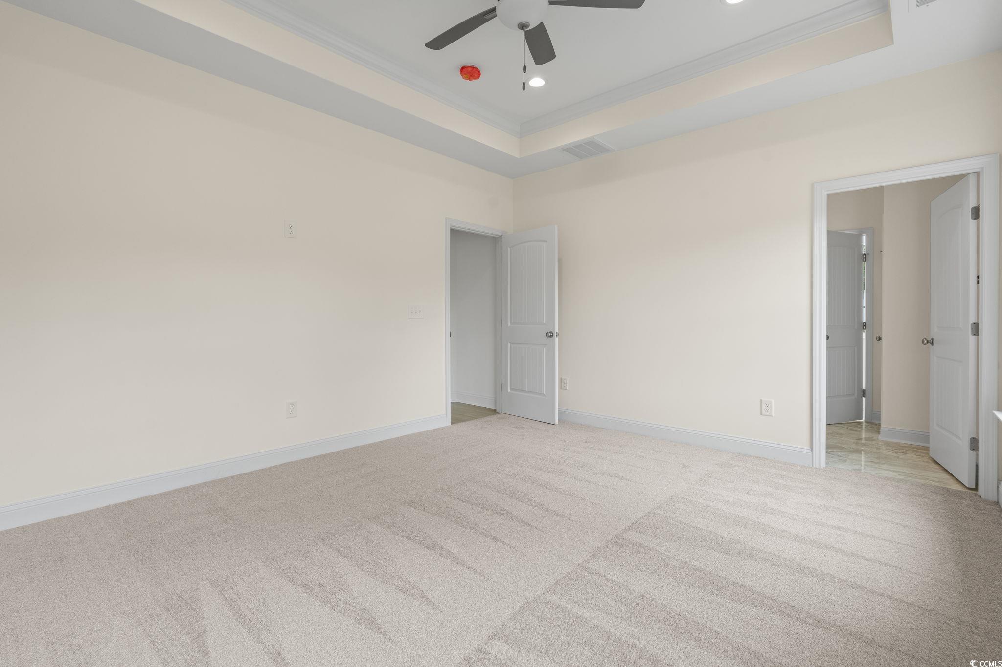 108 Infinity Lane Loris, SC 29569 - Photo 21 of 35 Primary bedroom featuring ornamental molding, ligh