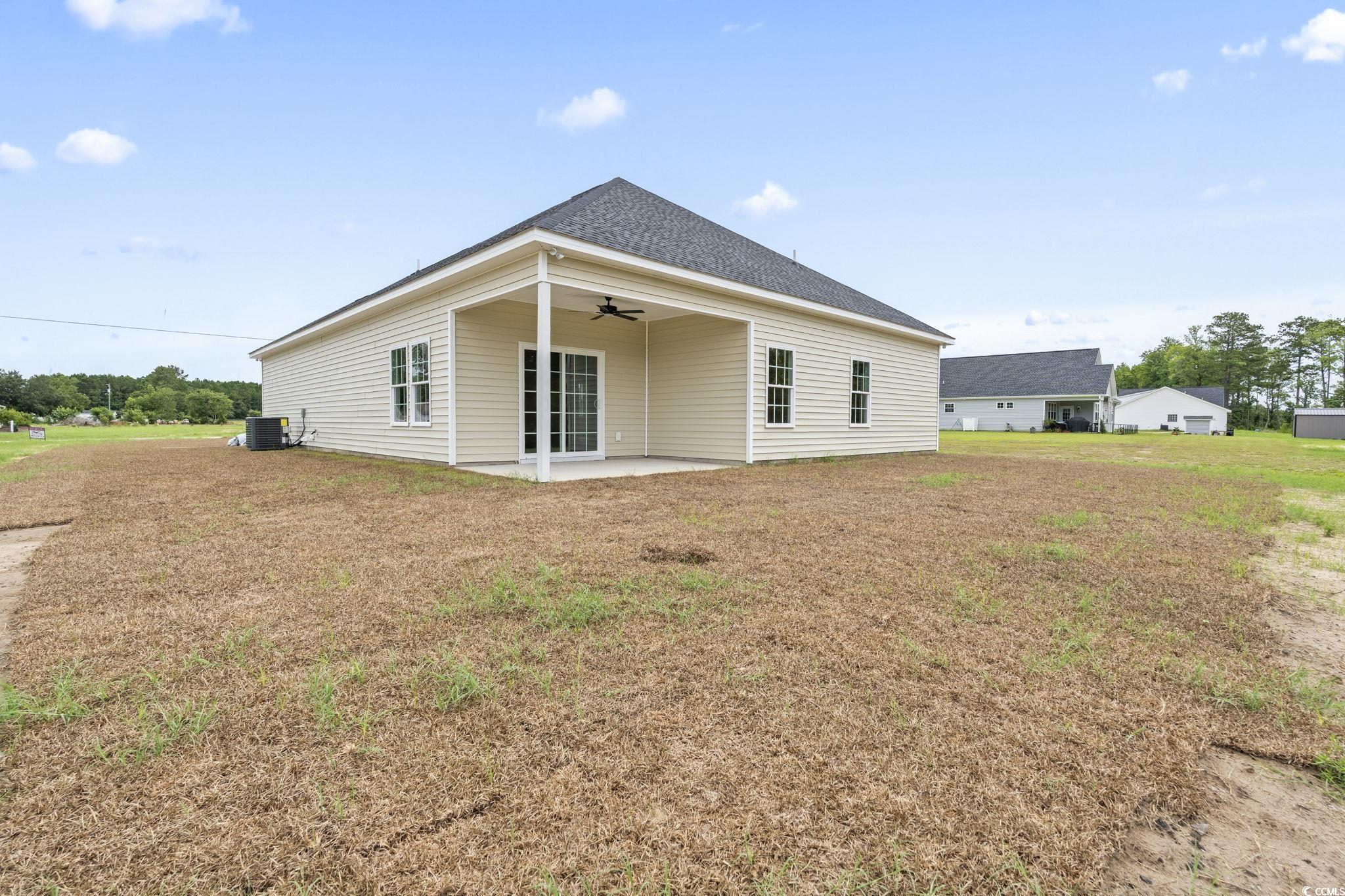 108 Infinity Lane Loris, SC 29569 - Photo 30 of 35 Rear view of house with ceiling fan, a patio, and
