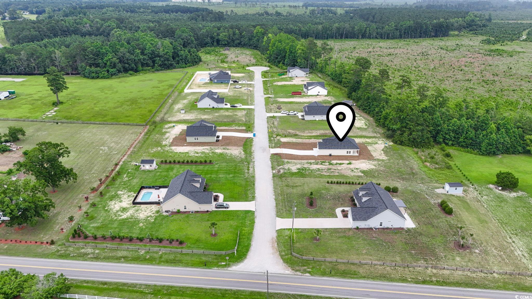 108 Infinity Lane Loris, SC 29569 - Photo 33 of 35 Drone / aerial view of a heavily wooded area