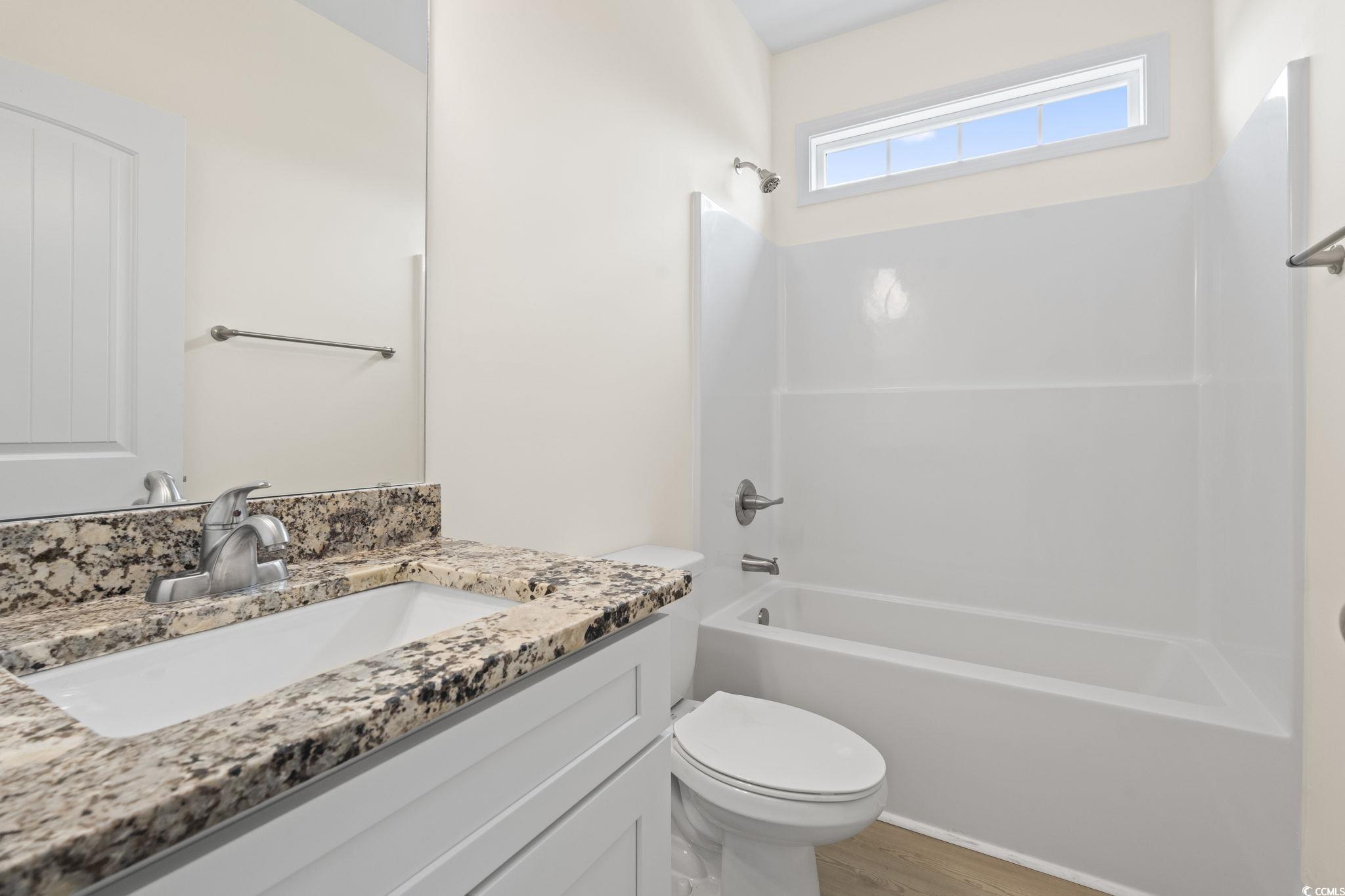 108 Infinity Lane Loris, SC 29569 - Photo 7 of 35 Full bathroom with vanity, bathing tub / shower co