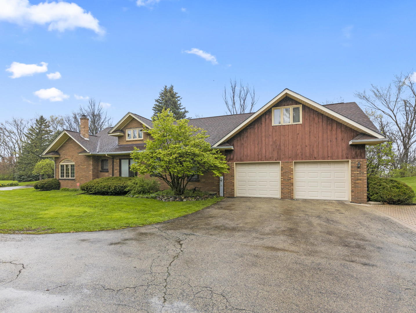 231 Bethany Road Sycamore, IL 60178 - Photo 6 of 37 a view of a house with a yard and large tree