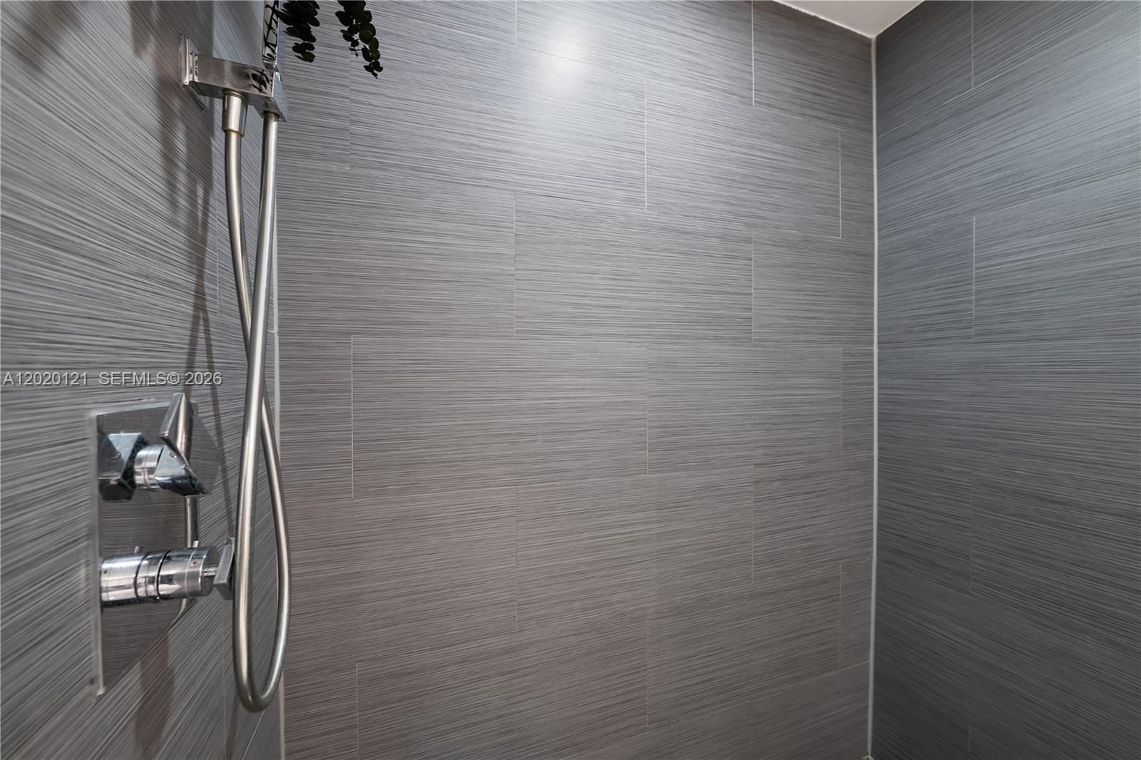 2101 Brickell Avenue, Unit 1909 Miami, FL 33129 - Photo 15 of 25 a bathroom with a shower
