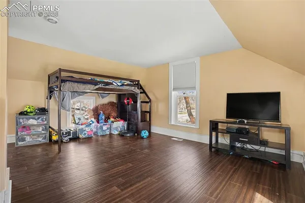 a view of a livingroom with hardwood floor and a couch