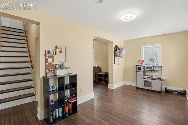 a room with furniture and wooden floor
