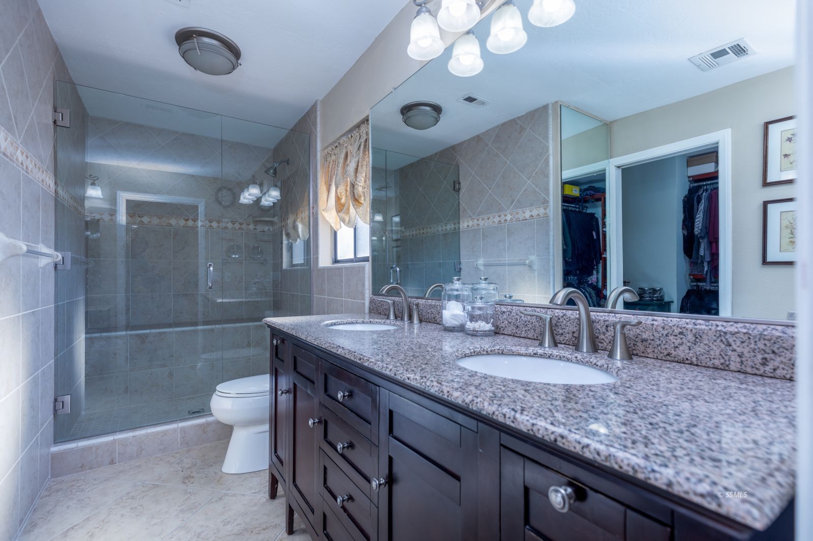 815 Hurschell Avenue Ridgecrest, CA 93555 - Photo 20 of 43 a bathroom with a granite countertop double vanity sink mirror and toilet