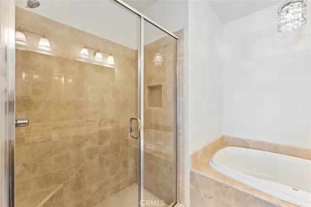 a bathroom with a bathtub and shower