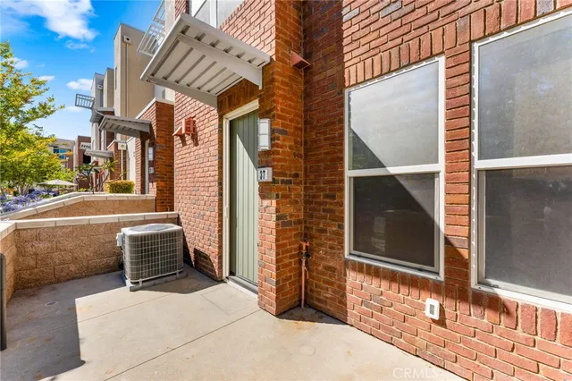 a backyard of a house with oven and barbeque oven
