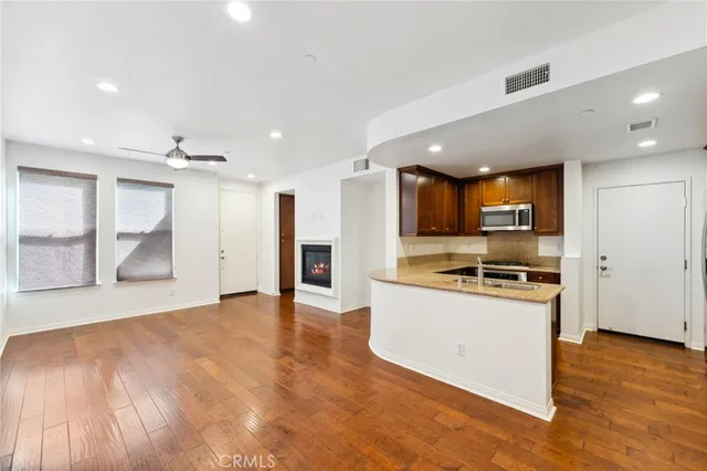 a view of a kitchen with a sink and a stove top oven