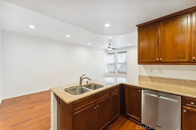a kitchen with a sink cabinets and window