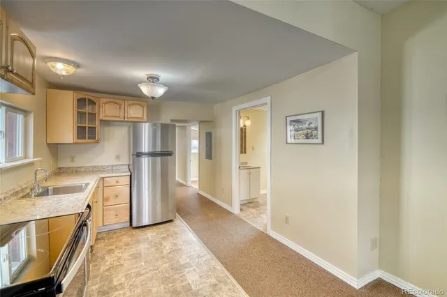 a view of a kitchen with a sink