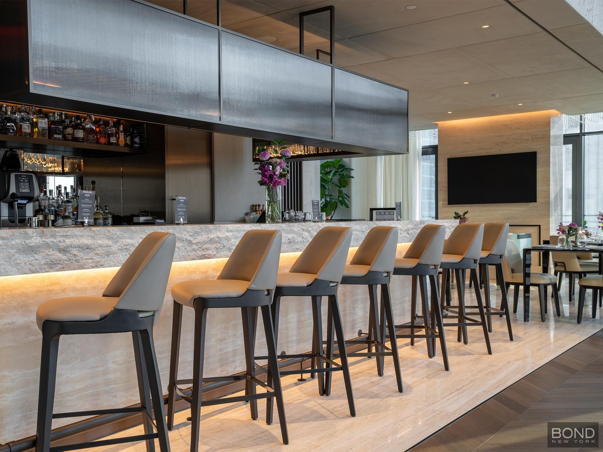 685 5th Avenue, Unit 9A Manhattan, NY 10022 - Photo 11 of 20 a dinning table and chairs in a kitchen