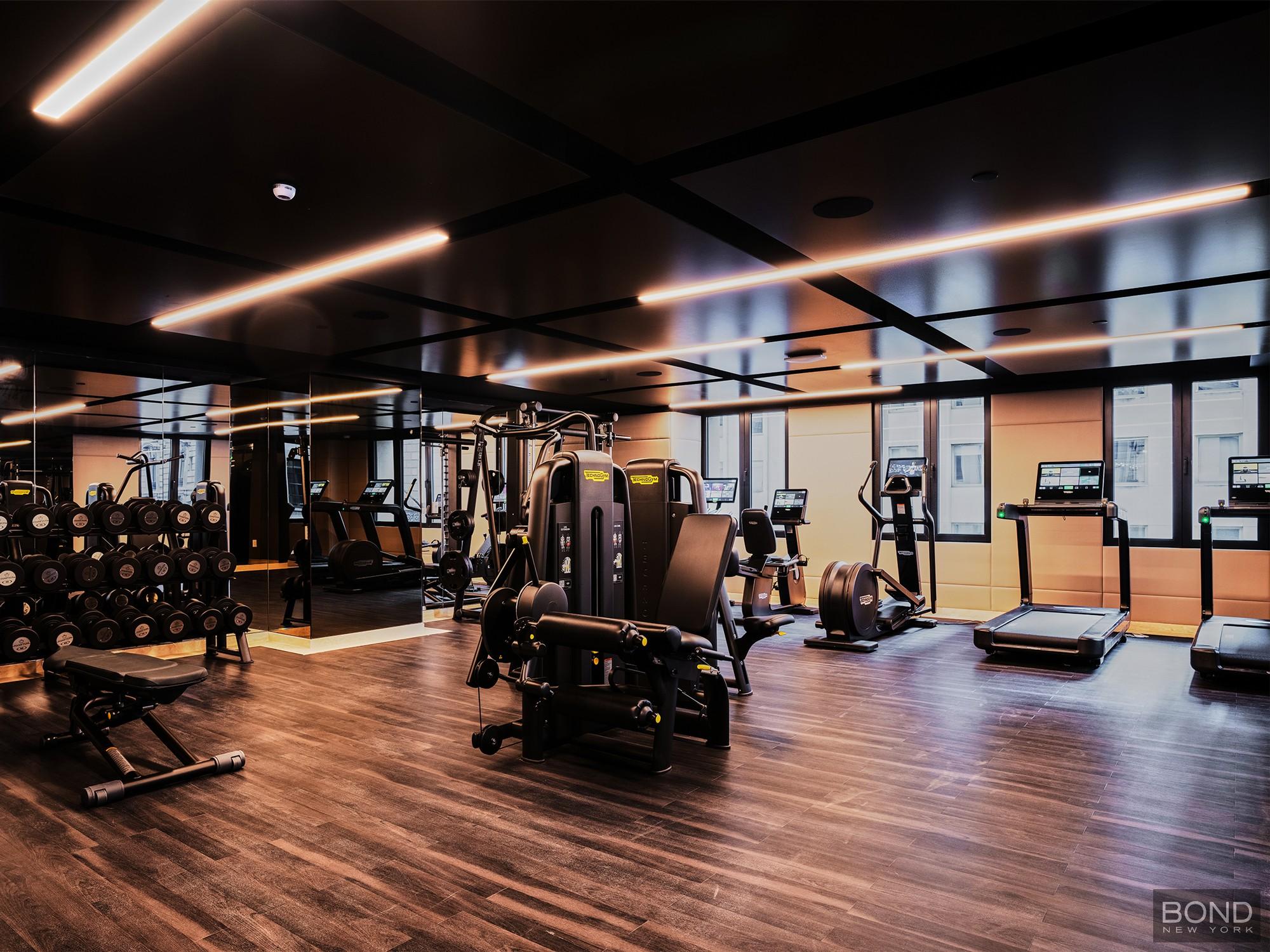 685 5th Avenue, Unit 9A Manhattan, NY 10022 - Photo 17 of 20 a view of a room with gym equipment