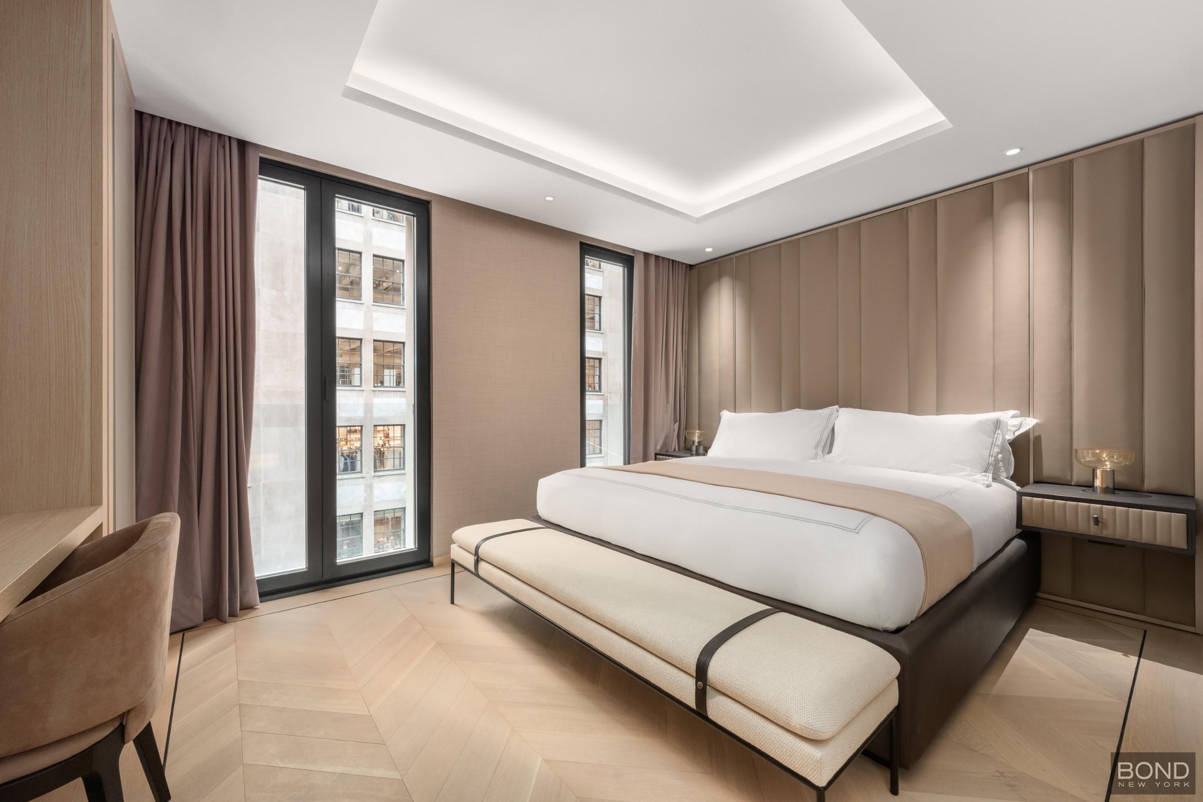 685 5th Avenue, Unit 9A Manhattan, NY 10022 - Photo 3 of 20 a spacious bedroom with a bed and large window