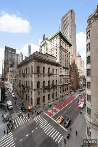 a bathroom with a granite countertop sink toilet a mirror and shower