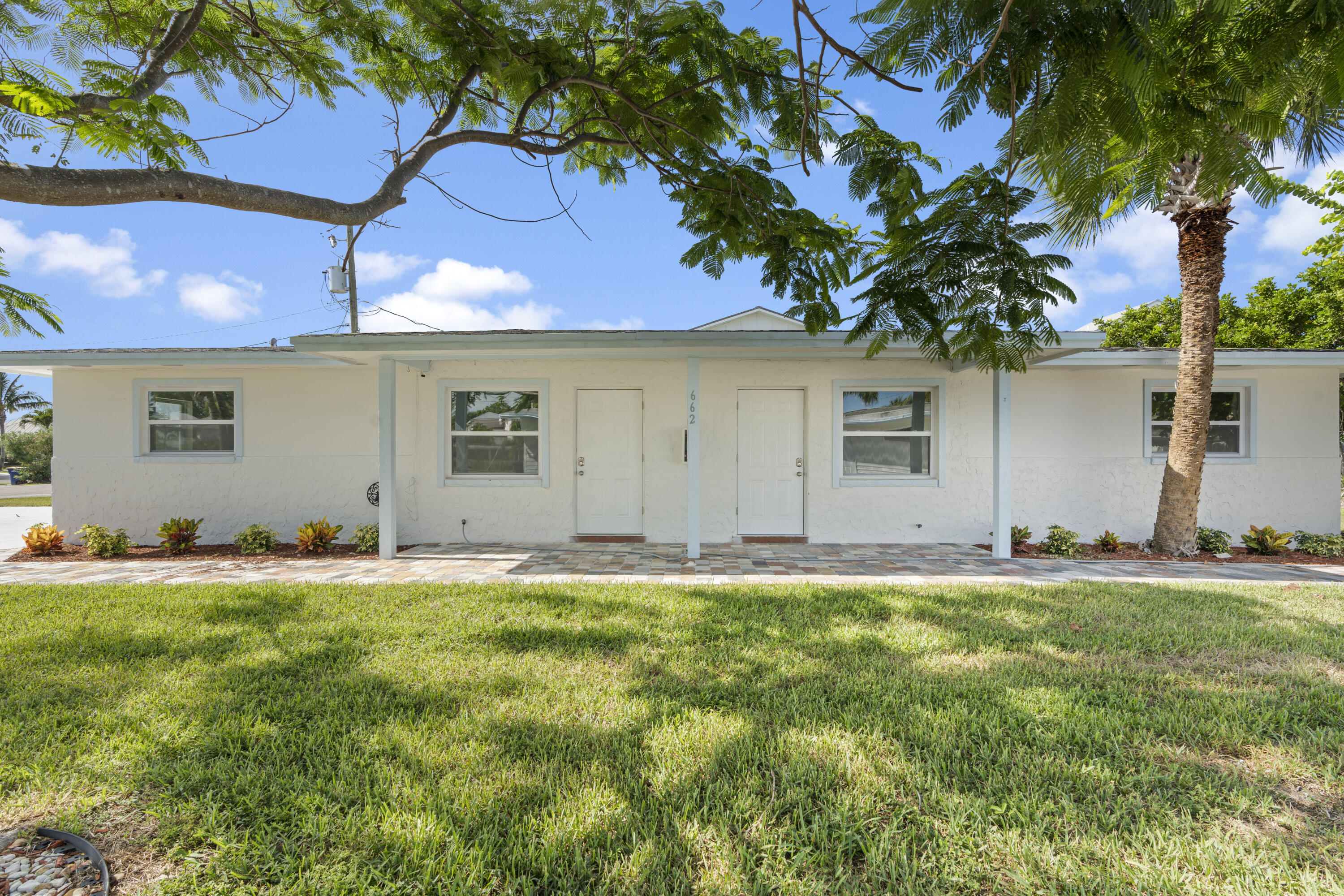 a house that has garden in front of it