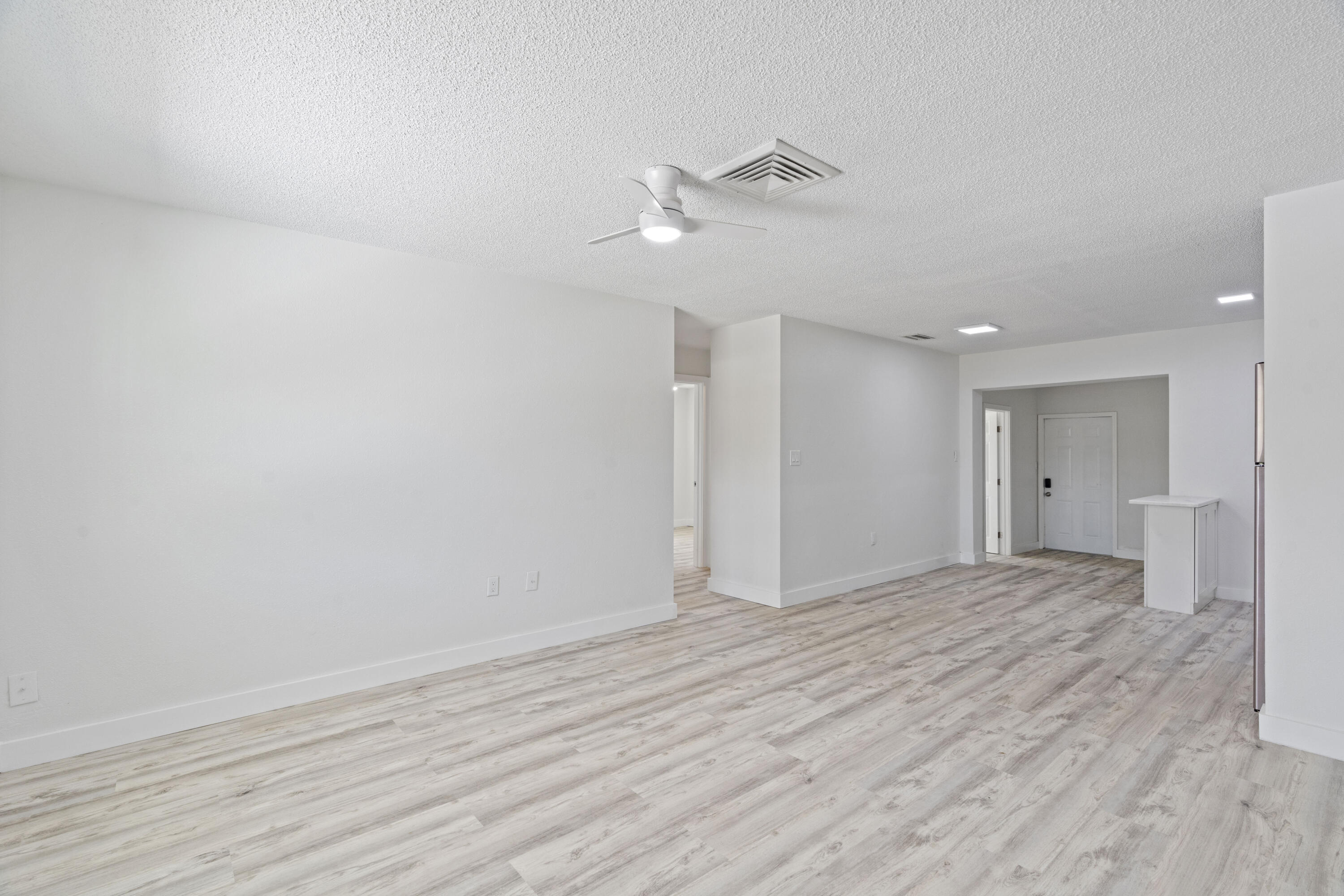 662 Granada Street Fort Pierce, FL 34949 - Photo 11 of 48 a view of empty room with wooden floor