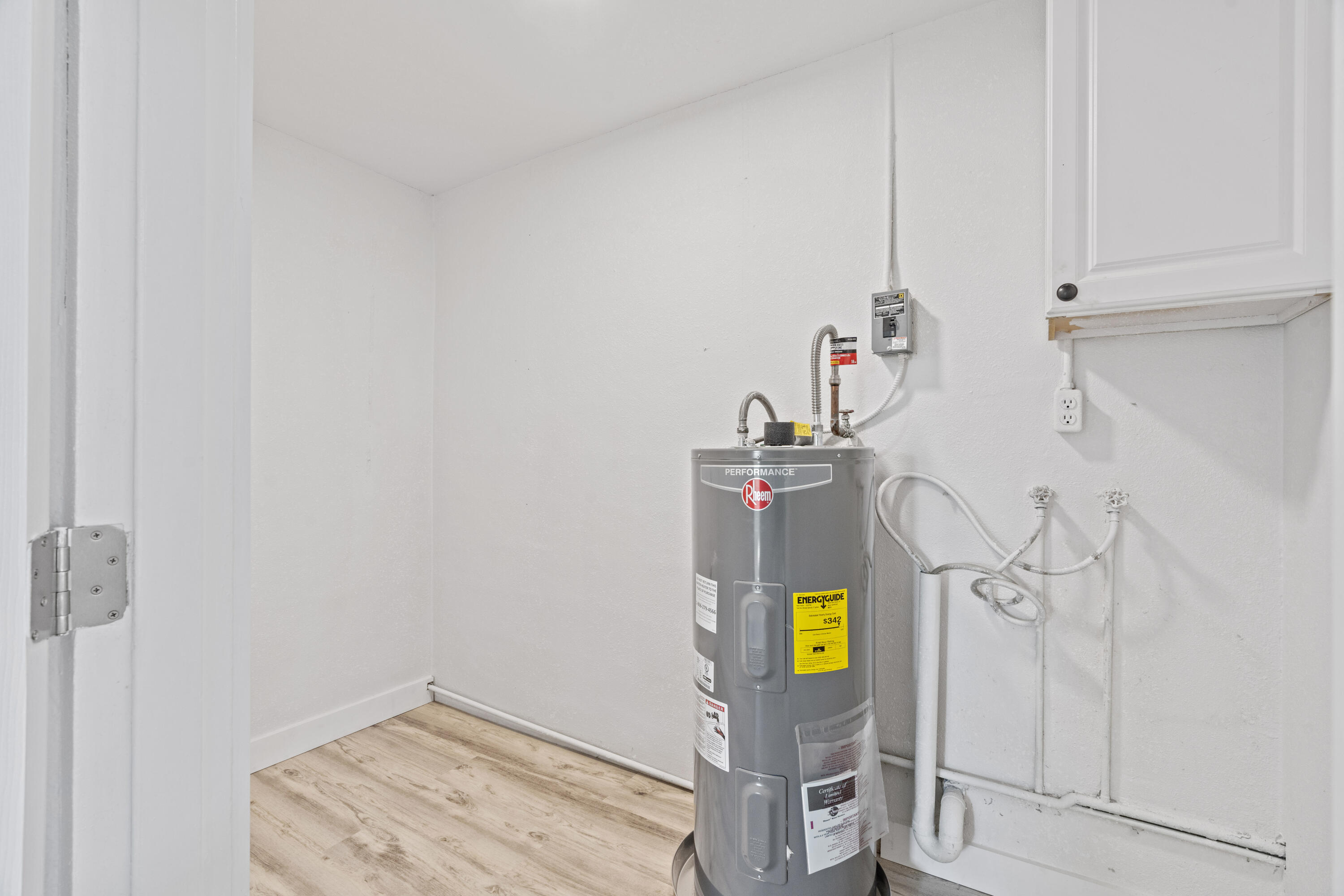 662 Granada Street Fort Pierce, FL 34949 - Photo 21 of 48 a view of storage and utility room with washer and dryer