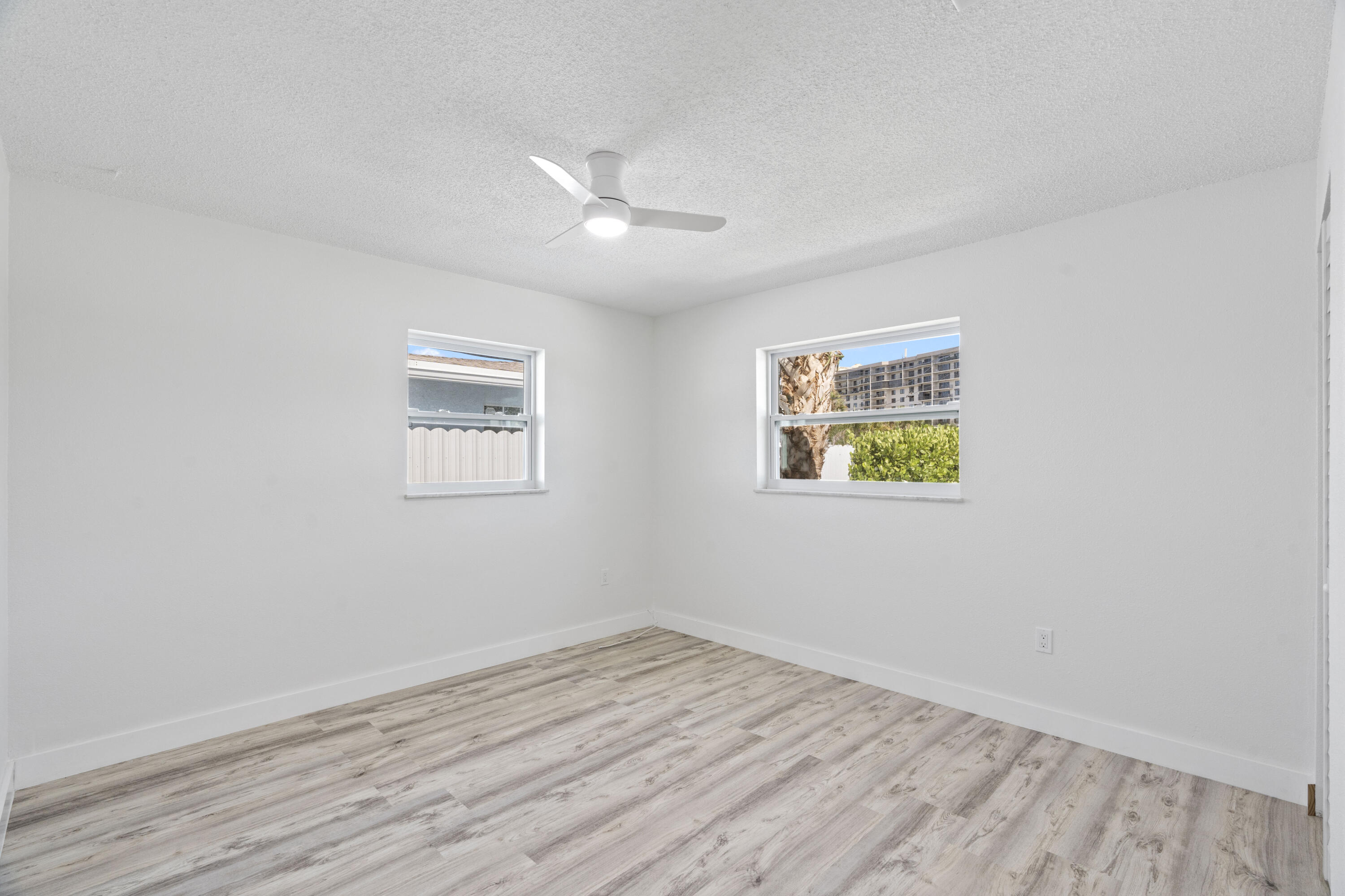 662 Granada Street Fort Pierce, FL 34949 - Photo 29 of 48 an empty room with wooden floor and window