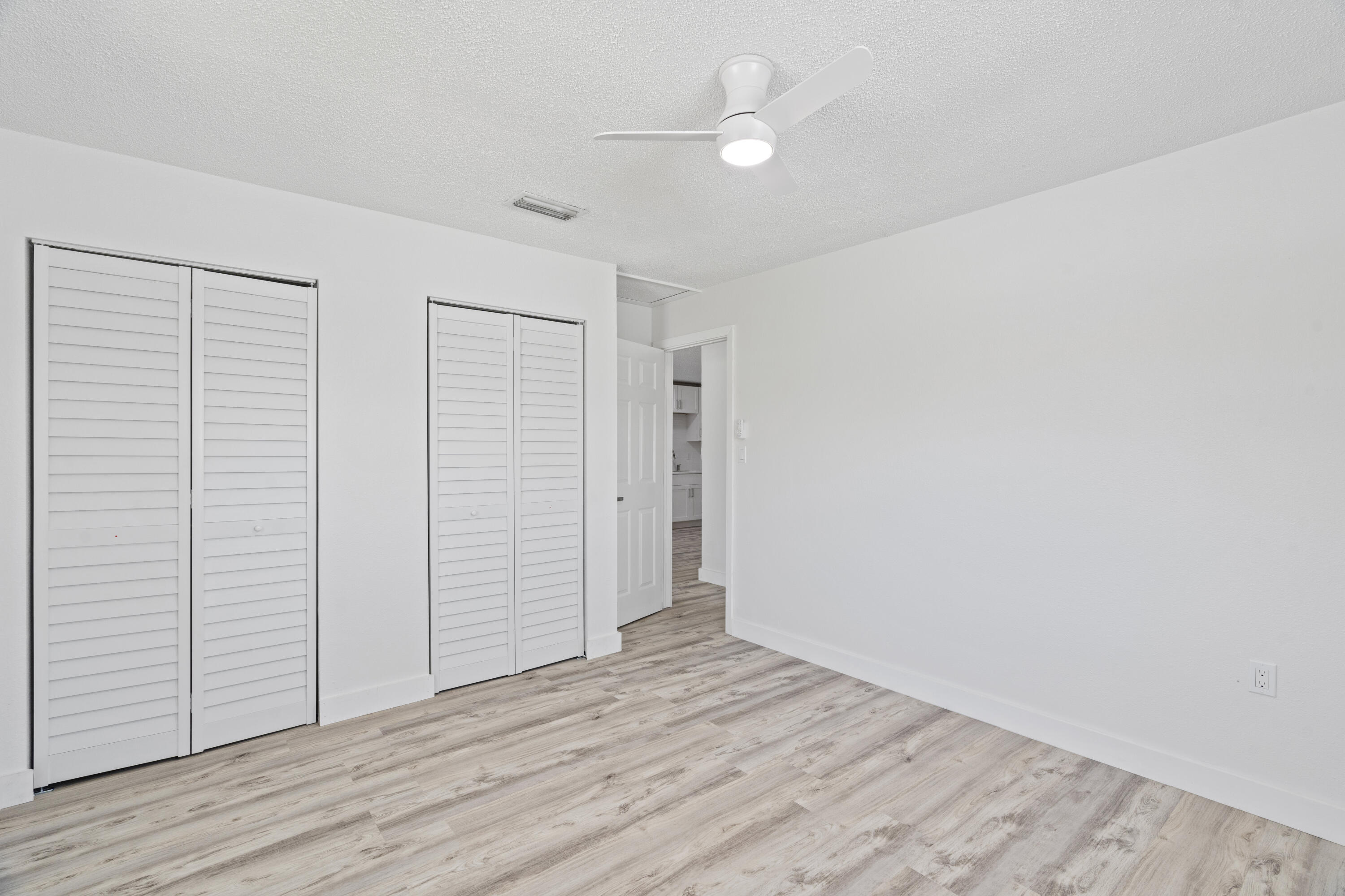 662 Granada Street Fort Pierce, FL 34949 - Photo 30 of 48 an empty room with wooden floor and closet