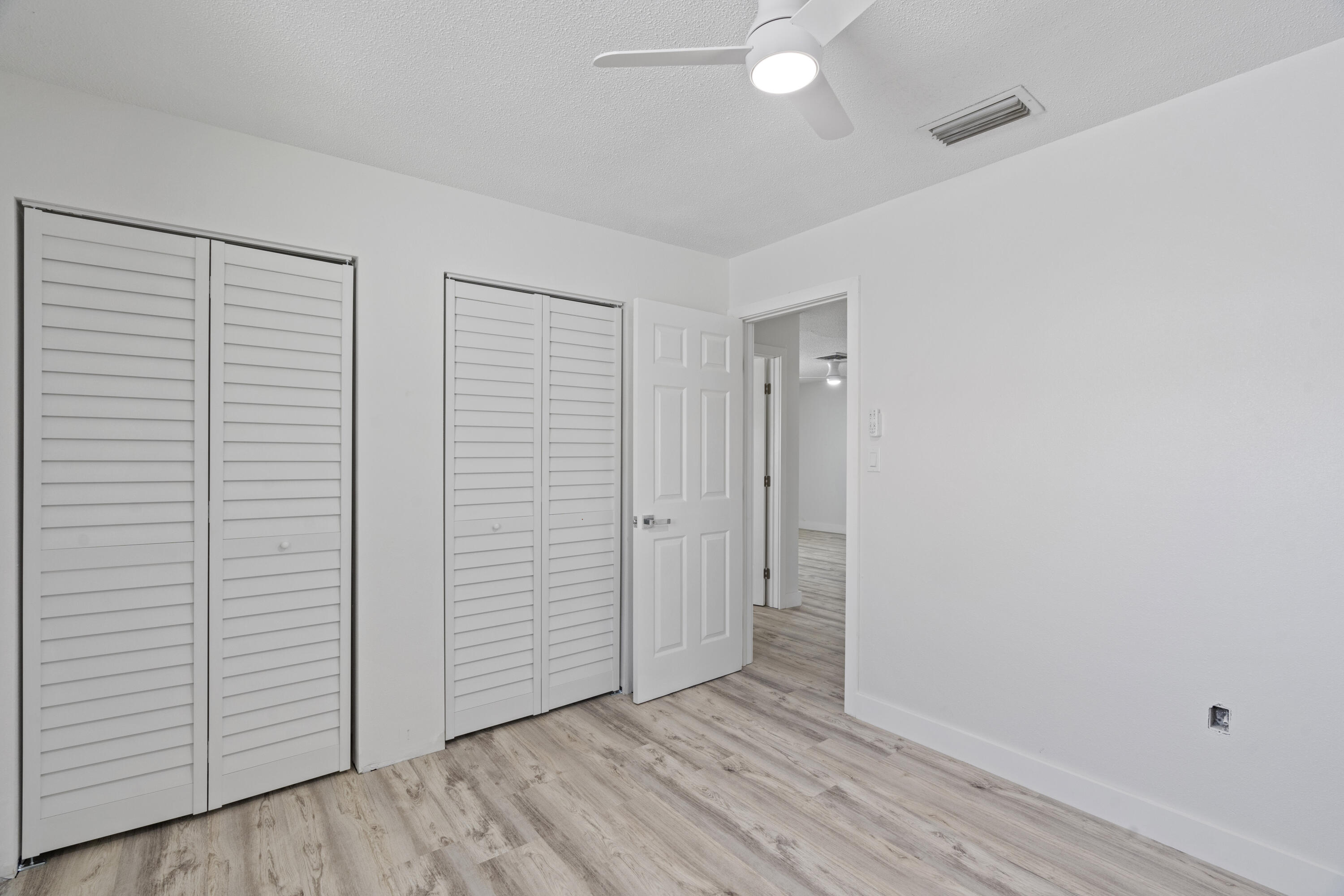 662 Granada Street Fort Pierce, FL 34949 - Photo 32 of 48 an empty room with wooden floor